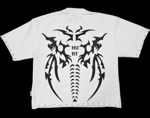 White cropped BKYS tee back with black tribal spine graphic and 'HURT' text, plus studded edges